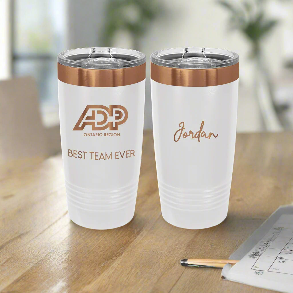Two white tumblers with rose gold accents and text on a white background